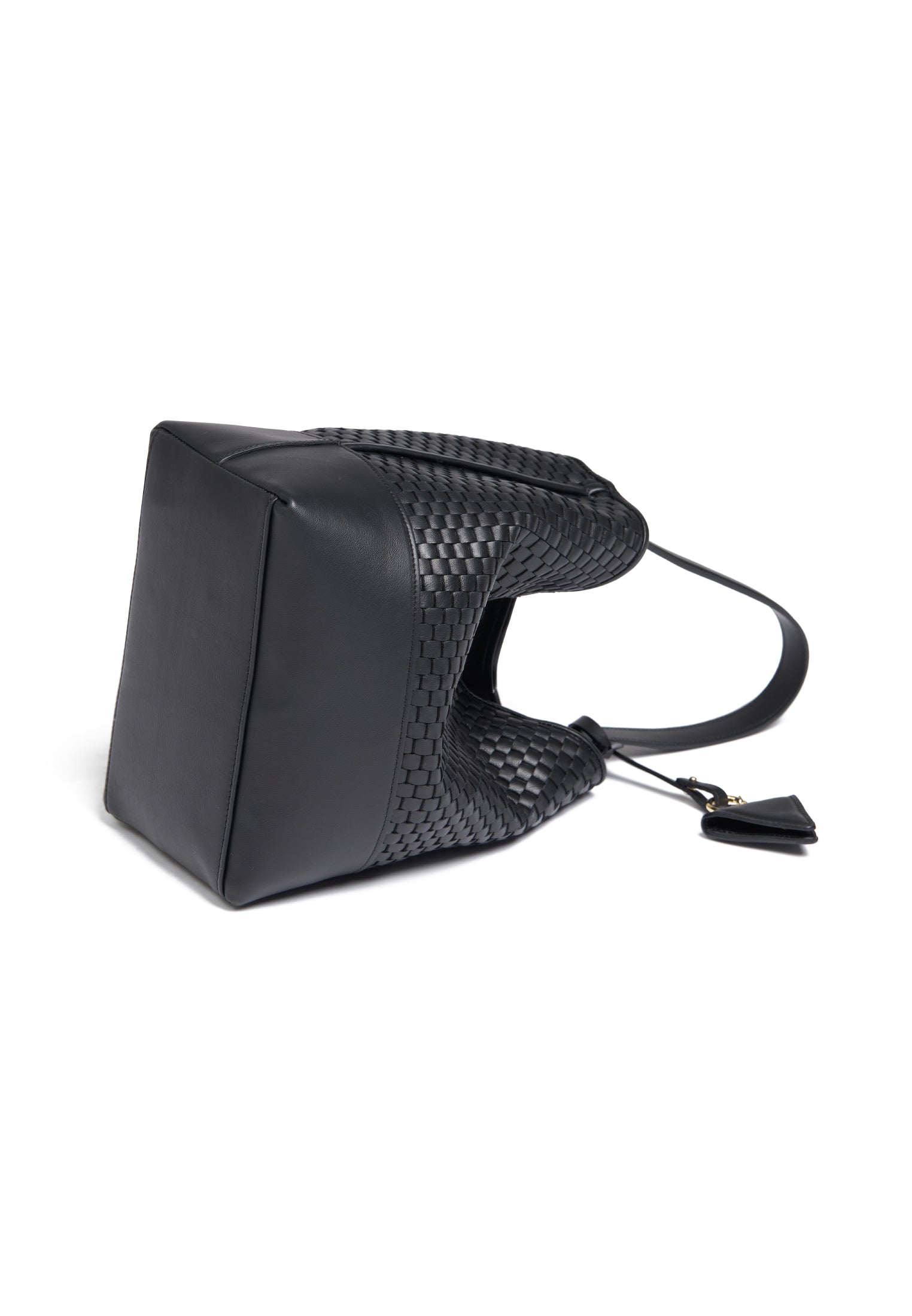 Flat view of the 51 Large Bucket bag with accessories, emphasizing its versatility and timeless elegance.