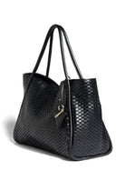 Side profile of the '09' Tubolar Plain bag, showcasing its soft yet structured silhouette.