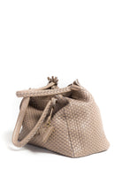 Close-up of the handle on the 09 Regular Acacia bag, showcasing the detailed weaving and durable craftsmanship