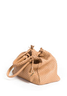 Close-up of the handle on the 09 Regular bag, showcasing the detailed weaving and durable craftsmanship