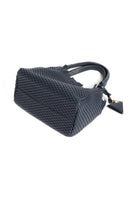 Flat-layout shot of the 09 Regular bag with its accessories, emphasising its versatility and timeless elegance.
