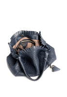 Interior view of the 09 Regular bag, displaying its spacious compartment and 100% cotton lining