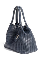 Side profile of the 09 Regular bag, highlighting its structured silhouette