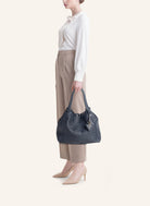 Parise 09 Regular bag styled with an outfit, demonstrating its versatility