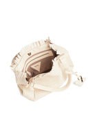 Interior view of the 09 Small Butter bag, displaying its spacious compartment and 100% cotton lining