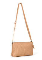 Side profile of the 21 Crossbody Bag, showcasing the adjustable and removable shoulder strap.