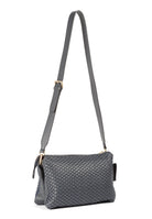 Side profile of the 21 Crossbody Bag, showcasing the adjustable and removable shoulder strap.