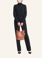 Model wearing the 51 Large Bucket Bag, styled as a sophisticated everyday statement piece.