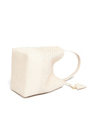 Flat view of the 51 Large Bucket bag with accessories, emphasizing its versatility and timeless elegance.